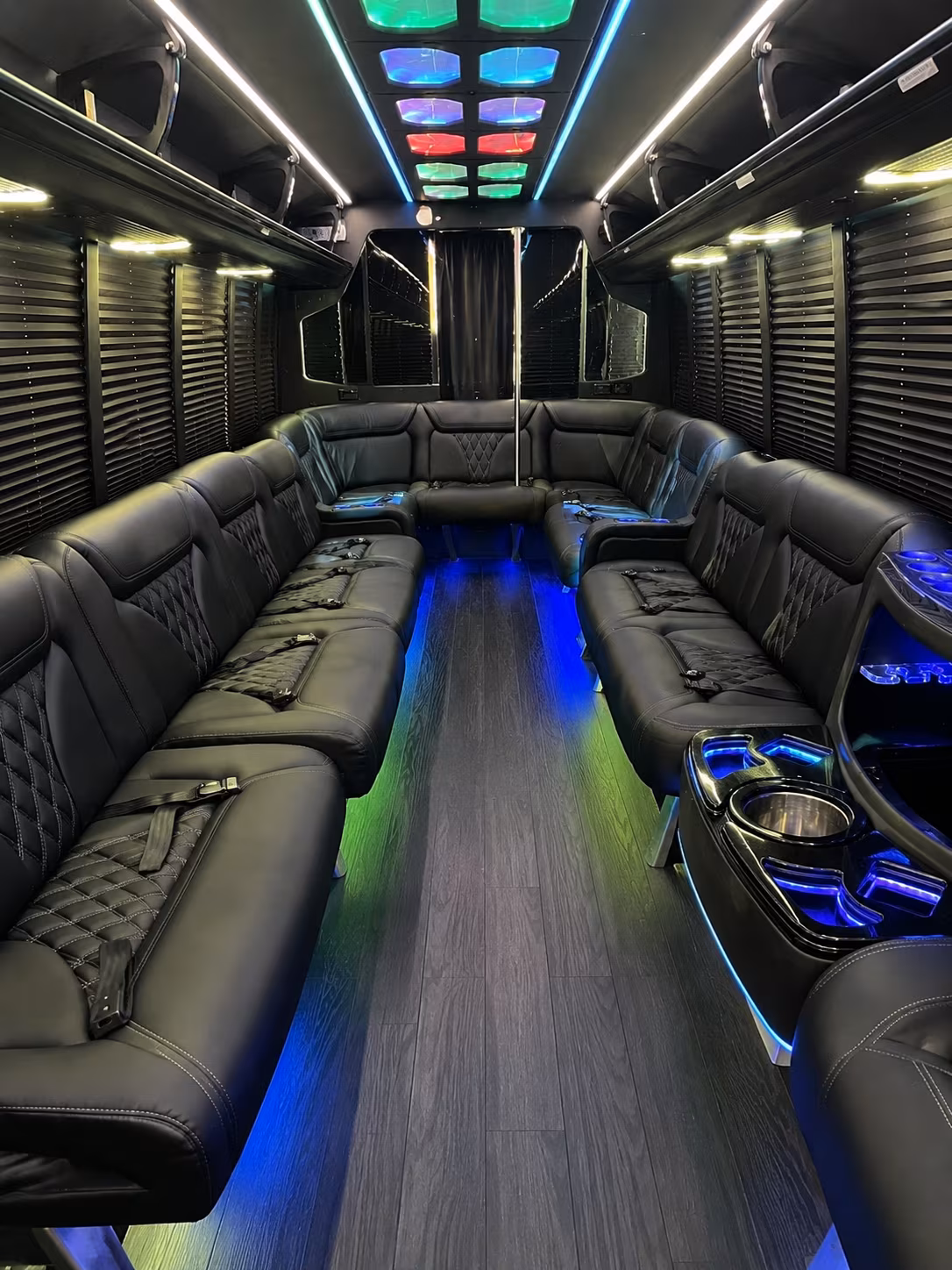 Group beside a Mercedes Sprinter limo in Fayetteville